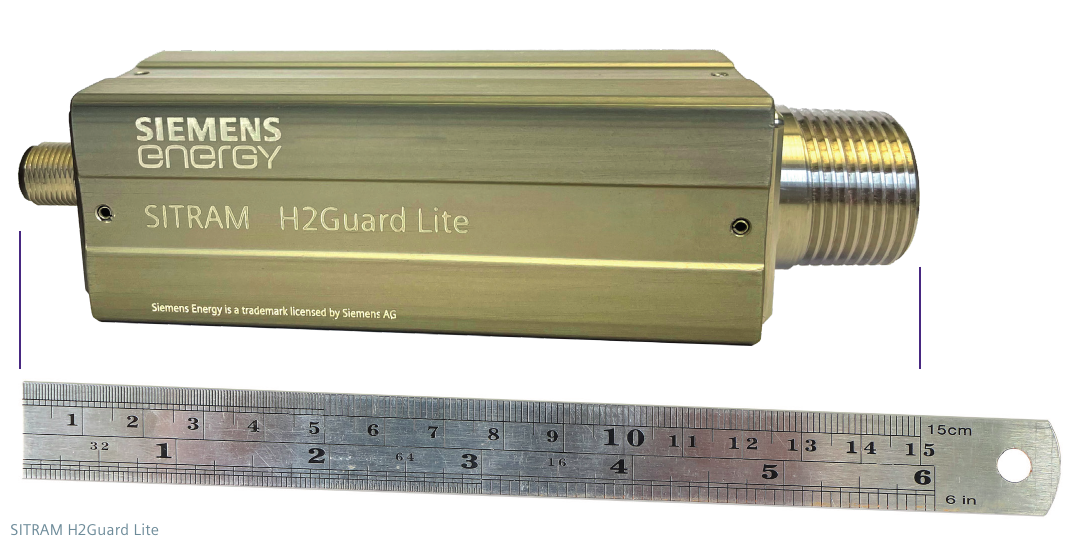 SITRAM H2Guard Lite hydrogen monitor — cast aluminum enclosure with engraved Siemens Energy and SITRAM H2Guard Lite markings and threaded stainless-steel probe connection, shown against a 15 cm rule for scale (brochure page 2).