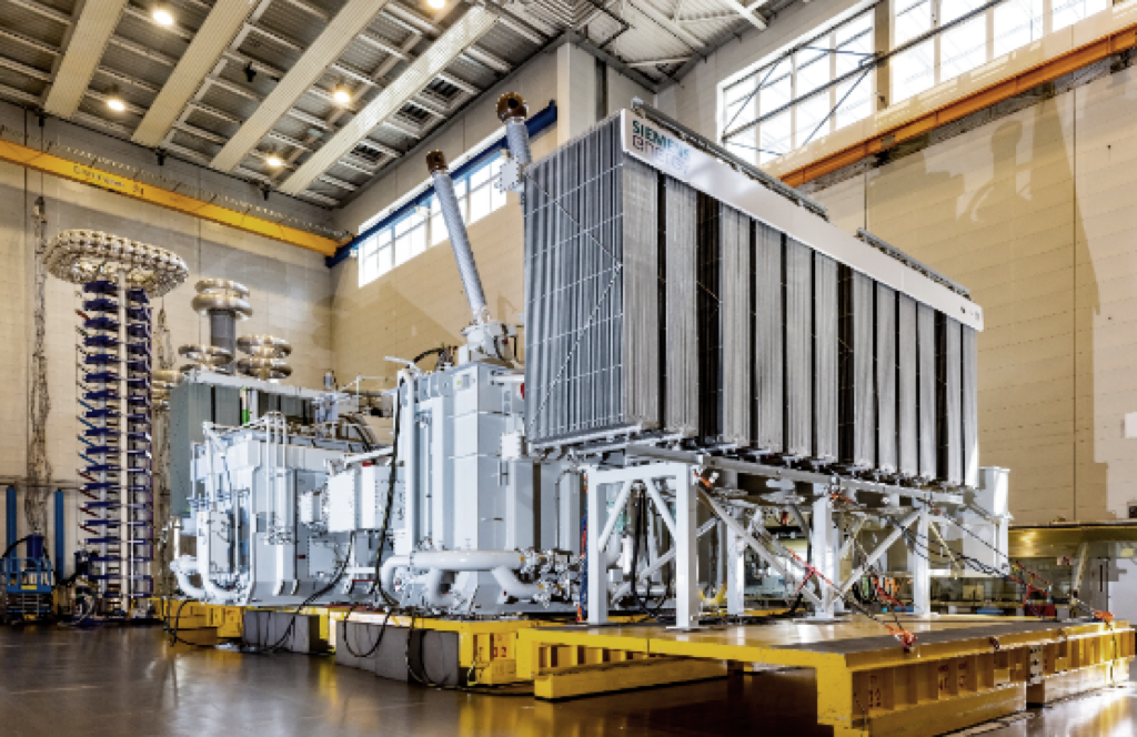 300 MVA 240/240 kV dual-tank reference unit with cooler bank in the factory test field (Canada, 2021)