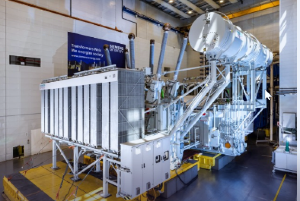 Two-core / dual-tank phase-shifting transformer in the test bay — design used above approx. 230 kV